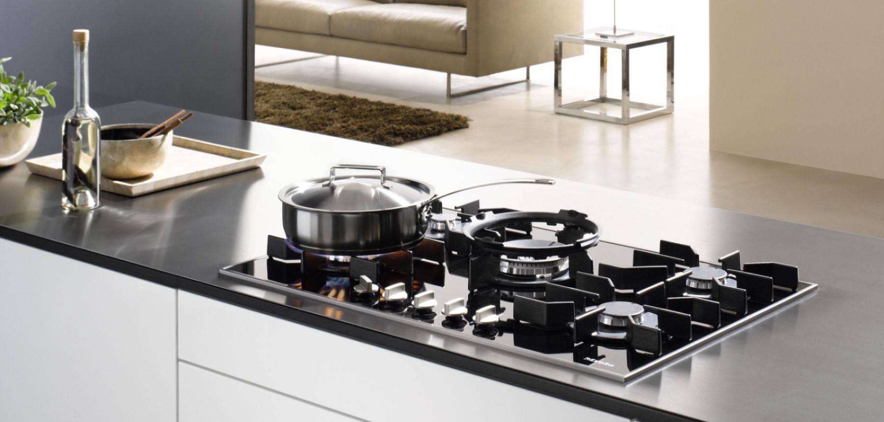 Miele gas hob with pan on the flame